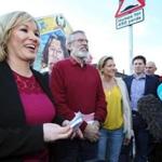 Top Sinn Fein party officials president Michelle O'Neill (left) and Gerry Adams (center) spoke to the media Saturday in West Belfast.