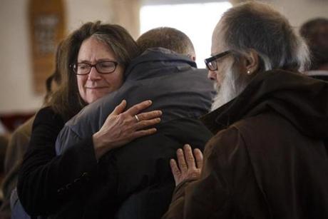 Warwick, MA - 3/5/2017 - Congregants of the Warwick Trinitarian Congregational Church comfort one another during a service that remembers a mother and four children that were killed in a house fire n Warwick, MA, March 5, 2017. (Keith Bedford/Globe Staff)
