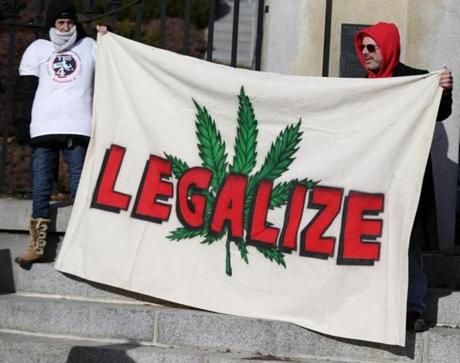 Marijuana supporters stood outside the State House on Dec. 30.
