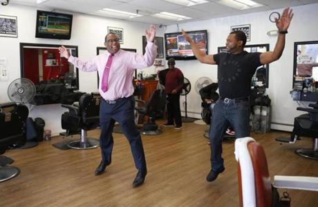 Roxbury, MA -- 3/9/2017 - Tito Jackson (L) does a quick workout with Cleon James, the owner of Top Notch Barber Shop on Washington Street in Roxbury as he drops in for a hair cut. () Topic: 11Tito Reporter: 

