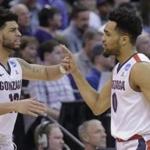 Gonzaga guards Josh Perkins, left, and Silas Melson (0) high-five during the second half of a first-round men's college basketball game against South Dakota State in the NCAA Tournament, Thursday, March 16, 2017, in Salt Lake City. Gonzaga won 66-46. (AP Photo/Rick Bowmer)