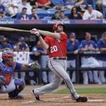 Washington Nationals' Daniel Murphy (20) bats against the New York Mets during a spring training baseball game Saturday, Feb. 25, 2017, in Port St. Lucie, Fla. (AP Photo/David J. Phillip)