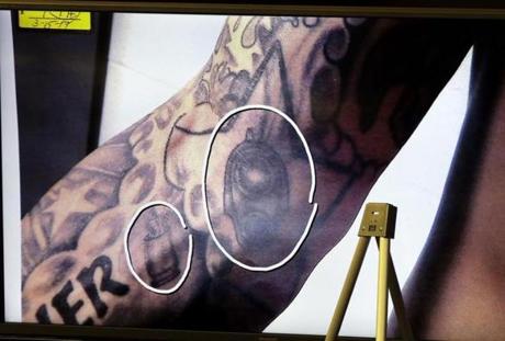 The tattooed arm of Aaron Hernandez was shown during testimony in his double murder trial Wednesday. 

