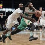 Boston Celtics forward Jae Crowder (99) drives past Brooklyn Nets forward Quincy Acy (13) during the fourth quarter of an NBA basketball game, Friday, March 17, 2017, in New York. The Celtics won 98-95. (AP Photo/Julie Jacobson)
