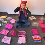 Brockton-02/24/2017 Beth McLaughlin wears her pink hat as she sits among other pink hats, part of an ever-expanding collection at the Fuller Craft Museum for a future display. John Tlumacki/Globe staff(south)