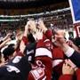 BOSTON, MA - FEBRUARY 13: Members of the Harvard Crimson celebrate with the Beanpot trophy after defeating the Boston University Terriers 6-3 in 2017 Beanpot Tournament Championship at TD Garden on February 13, 2017 in Boston, Massachusetts. (Photo by Maddie Meyer/Getty Images)