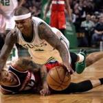 Boston, MA - 3/20/2017 - (4th quarter) Washington Wizards forward Kelly Oubre Jr. (12) and Boston Celtics guard Isaiah Thomas (4) dive for a loose ball during the fourth quarter. The Boston Celtics host the Washington Wizards at TD Garden. - (Barry Chin/Globe Staff), Section: Sports, Reporter: Adam Himmelsbach, Topic: 21Celtics-Wizards, LOID: 8.3.1932802928.