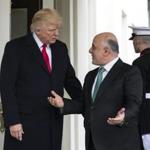 epa05860557 US President Donald J. Trump (L) welcomes Prime Minister Haider al-Abadi of Iraq (R) to the White House in Washington, DC, USA, 20 March 2017. EPA/JIM LO SCALZO
