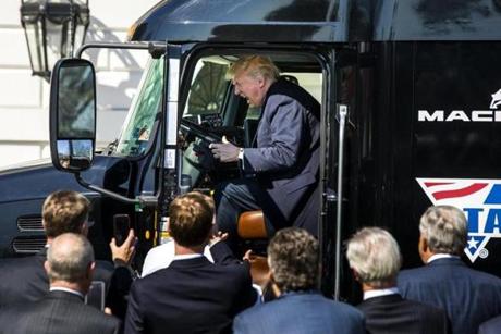 President Donald Trump climbed into the driver's seat of an 18-wheeler while meeting with truck drivers and CEOs on the South Portico. 
