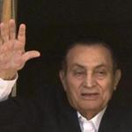 FILE - In this April 25, 2016 file photo, ousted Egyptian President Hosni Mubarak waves to his supporters from his room at the Maadi Military Hospital, where he is hospitalized, as they celebrate Sinai Liberation Day that marks the final withdrawal of all Israeli military forces from Egypt's Sinai Peninsula in 1982, in Cairo, Egypt. Egypt's state news agency says prosecutor has ordered the release of ousted President Hosni Mubarak on Monday, March 13, 2017. (AP Photo/Amr Nabil, File)