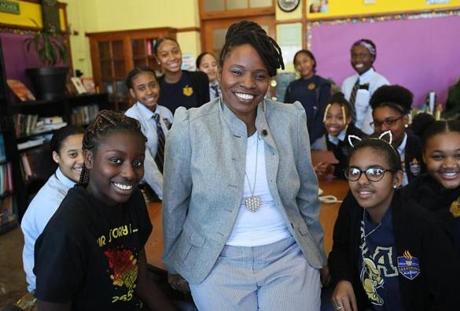 Lovely Hoffman, a middle school teacher at the Helen Y. Davis Leadership Academy in Dorchester, with some of her students.
