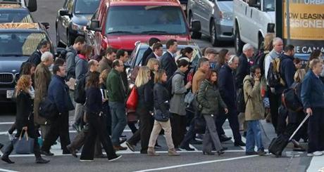 BOSTON, MA - 11/02/2016: THE MORNING RUSH HOUR in Boston at 9am crossing Atlantic Avenue and Summer Street from South Station in Boston. (David L Ryan/Globe Staff Photo) SECTION: METRO TOPIC stand alone photo
