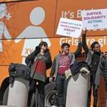 BOSTON, MA - 3/30/2017: Bus displaying anti-transgender messages, the so-called Free Speech Bus is travelling through Boston with stops at City Hall and seeen here by the State House with protesters greeting it. (David L Ryan/Globe Staff Photo) SECTION: METRO TOPIC 31bus