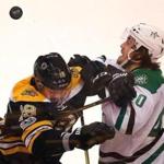 Boston-03/30/2017- Bruins vs Dallas Stars- Bruins Drew Stafford and stars Remi Elie battle for a loose puck that ends up over their heads in the 3rd period. John Tlumacki/Globe staff(sports)
