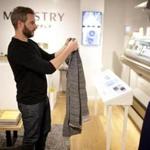 Brian Kennedy of Ministry of Supply inspected a sweater made on the 3D Print-Knit machine.