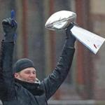 BOSTON - FEBRUARY 7: New England Patriots quarterback Tom Brady holds up a Lombardi Trophy during the New England Patriots Super Bowl LI Victory Parade in Boston on Feb. 7, 2017. (David L Ryan/Globe Staff Photo) SECTION: METRO TOPIC 08parade