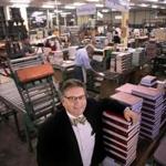 Charlestown, MA - 03/16/17 - Parisi on the bindery floor. Paul Parisi (cq) is president and COO of HF Group. He runs Acme Bookbinding, a second-generation binder, and he grew up in a small family-owned shop. Acme has grown from a one-person basement operation to a 150-employee company in a modern 100,000 square-foot facility with world class systems and machinery. They bind everything from single run copies to hundreds of thousands of books. Acme traces its beginnings back to 1821 via an acquired company, and is thus the oldest continuously operated book bindery in the world. (Lane Turner/Globe Staff) Reporter: (Cindy Atoji Keene) Topic: (03onthejob)