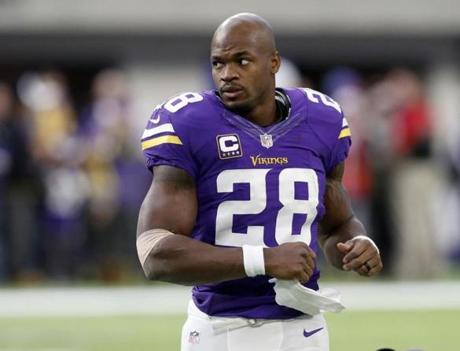 Minnesota Vikings running back Adrian Peterson warms up before the start of an NFL football game between the Indianapolis Colts and the Minnesota Vikings Sunday, Dec. 18, 2016, in Minneapolis. (AP Photo/Charlie Neibergall)
