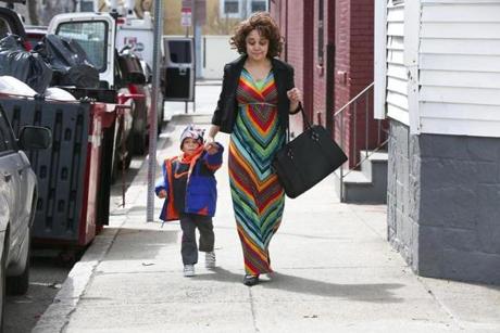 Kimberly Harris walked with her 3-year-old son, Christian, on Monday, near where a 6-year-old boy was shot the night before.
