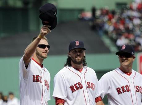 Boston Red Sox pitcher Chris Sale tips his cap to cheering fans during Red Sox Home Opening Day ceremonies at Fenway Park, Monday, April 3, 2017, in Boston. The Red Sox face the Pittsburgh Pirates in the baseball game. (AP Photo/Elise Amendola)
