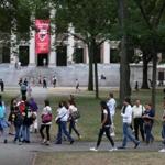 CAMBRIDGE MA - 9/10/2015: A tour group at Harvard University....Harvard issues new rules for tourists as people flock to Harvard Yard asking visitors to respect the privacy of it's students. (David L Ryan/Globe Staff Photo) SECTION: METRO TOPIC 11harvardyard