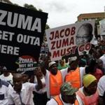 Demonstrators protest against South African President Jacob Zuma outside the union building in Pretoria, South Africa, Friday, April 7, 2017. South Africans are gathering for nationwide demonstrations against Zuma, whose dismissal of the finance minister fueled concerns over government corruption and economic weakness. (AP Photo/Themba Hadebe)
