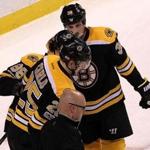 Boston, MA - 4/08/2017 - (1st period) Boston Bruins defenseman Brandon Carlo (25) is assisted off the ice after taking a heavy hit during the first period. The Boston Bruins host the Washington Capitals in the regular-season finale at TD Garden. - (Barry Chin/Globe Staff), Section: Sports, Reporter: Fluto Shinzawa, Topic: 08Capitals-Bruins, LOID: 8.3.2114921359.