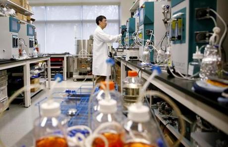 A scientist operated bioreactors at the drug company EMD Serono in Bedford.
