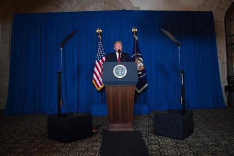 TOPSHOT - US President Donald Trump delivers a statement on Syria from the Mar-a-Lago estate in West Palm Beach, Florida, on April 6, 2017. Trump ordered a massive military strike against a Syria Thursday in retaliation for a chemical weapons attack they blame on President Bashar al-Assad. A US official said 59 precision guided missiles hit Shayrat Airfield in Syria, where Washington believes Tuesday's deadly attack was launched. / AFP PHOTO / JIM WATSONJIM WATSON/AFP/Getty Images
