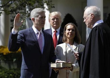 President Donald Trump watched as Supreme Court Justice Anthony Kennedy administered the judicial oath to Judge Neil Gorsuch. 
