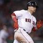 Boston Red Sox's Christian Vazquez rounds first on a two-RBI triple during the eighth inning of a baseball game against the Baltimore Orioles at Fenway Park in Boston, Tuesday, April 11, 2017. (AP Photo/Charles Krupa)