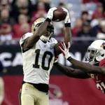 New Orleans Saints wide receiver Brandin Cooks (10) makes a catch as Arizona Cardinals cornerback Patrick Peterson (21) defends during the second half of an NFL football game, Sunday, Dec. 18, 2016, in Glendale, Ariz. (AP Photo/Rick Scuteri)
