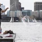 Aleander Dorsk made bubbles over the pier on the Charles River Esplanade during the warm weather Tuesday. 