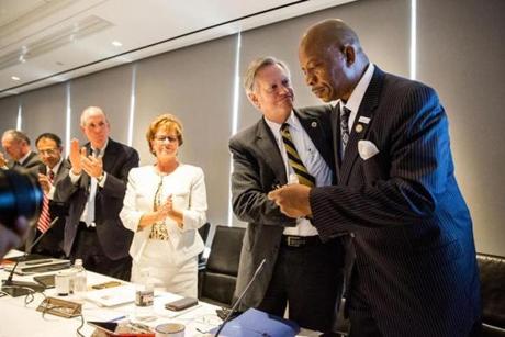 Chancellor J. Keith Motley (right) was greeted by Peyton Randolph Helm, interim chancellor of UMass Dartmouth, after speaking Tuesday during the UMass Board of Trustees? Committee of the Whole meeting at the UMass Club in Boston. 
