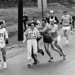 In 1967, Kathrine Switzer, of Syracuse, N.Y., center, was spotted early in the Boston Marathon by Jock Semple, center right, who tried to rip the number off her shirt and remove her from the race. 