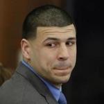 Former New England Patriots tight end Aaron Hernandez turns to look in the direction of the jury as he reacts to his double murder acquittal on Friday.