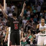 Boston MA 4/16/17 Boston Celtics Al Horford walks off the court as Chicago Bulls Bobby Portis signals victory during the first round of the NBA Playoffs at TD Garden. (Photo by Matthew J. Lee/Globe staff) topic: reporter: 