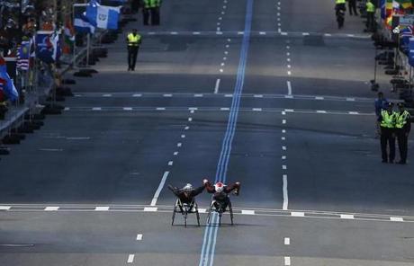 sldier: Boston, Massachusetts -- 4/17/2017 - Wheelchair racers Marcel E. Hug (L) and Ernst Van Dyk race down Boylston Street towards the finish line of the 121st Boston Marathon. (Jessica Rinaldi/Globe Staff) Topic: Marathonpics Reporter: 
