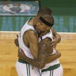 epa05911745 Boston Celtics guard Avery Bradley (L) embraces Boston Celtics guard Isaiah Thomas (R) after the two players scored consecutive three pointer against the Chicago Bulls during the first half of their NBA Eastern Conference first round playoff series game at the TD Garden in Boston, Massachusetts, USA 16 April 2017. EPA/CJ GUNTHER
