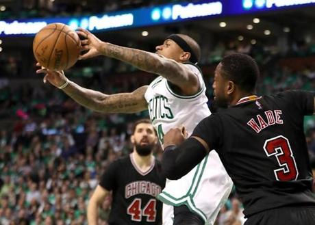 Boston MA 4/18/17 Boston Celtics Isaiah Thomas makes a pass in the lane with pressure from Chicago Bulls Dwayne Wade during second quarter of game 2 of the first round of the NBA Playoffs at TD Garden. (Photo by Matthew J. Lee/Globe staff) topic: reporter: 
