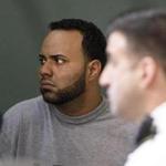 Angelo Colon-Ortiz listened to his attorney at his arraignment Tuesday. 