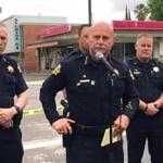 Fresno police chief Jerry Dyer, front, briefs reporters in Fresno, Calif., after a shooting Tuesday, April 18, 2017. A man shot and killed three people on the streets of downtown Fresno shouting 