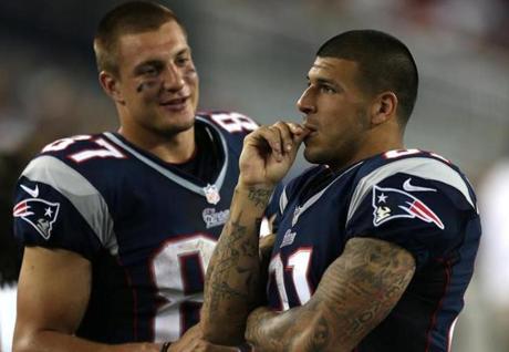 Foxborough, MA - 08/09/12 - (2nd Quarter) New England Patriots tight end Rob Gronkowski (87) and New England Patriots tight end Aaron Hernandez (81) on the sidelines during the second quarter. - (Globe Staff Photo / Barry Chin), section: Sports, reporter: Youngs, slug: 10Saints-Patriots, LOID: 5.0.2209808092.
