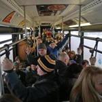 A packed shuttle bus leaving the Quincy Adams Red Line station for Quincy Center station three winters ago. 