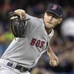 Boston Red Sox starting pitcher Chris Sale throws against the Toronto Blue Jays during the first inning of a baseball game in Toronto on Thursday, April 20, 2017. (Fred Thornhill/The Canadian Press via AP)