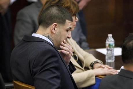 Aaron Hernandez marked his forehead with a biblical phrase before apparently taking his own life Wednesday. 
