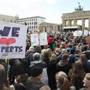 People gathered in front of the Brandenburg Gate in support of scientific research during the 