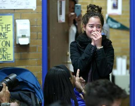 East Boston MA 04/25/2017 Yesica Calderon (cq) reacts to a room full of friends and family inside the school's library . In a surprise annoucement to all who were gathered, Yesica, won a full academic scholarship to Regis College. GlobeStaff) Reporter:Topic
