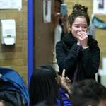 East Boston MA 04/25/2017 Yesica Calderon (cq) reacts to a room full of friends and family inside the school's library . In a surprise annoucement to all who were gathered, Yesica, won a full academic scholarship to Regis College. GlobeStaff) Reporter:Topic