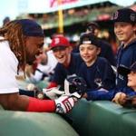 BOSTON, MA - APRIL 27: Hanley Ramirez #13 of the Boston Red Sox gives his hat to a young fan before a game against the New York Yankees at Fenway Park on April 27, 2017 in Boston, Massachusetts. (Photo by Adam Glanzman/Getty Images) ***BESTPIX***